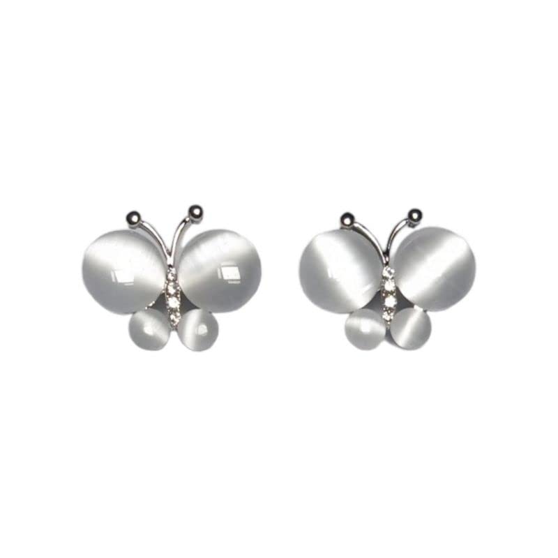 Butterfly-shaped earrings with pearl accents on a white background