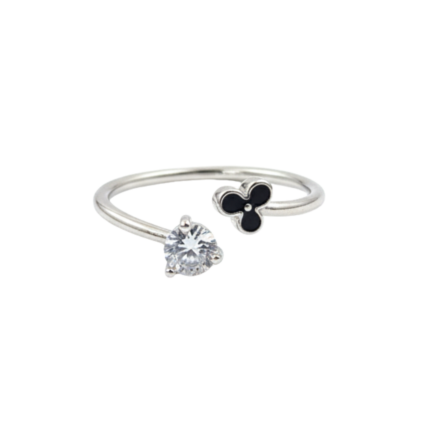 Silver ring with a heart-shaped gemstone and clover charm on a white background
