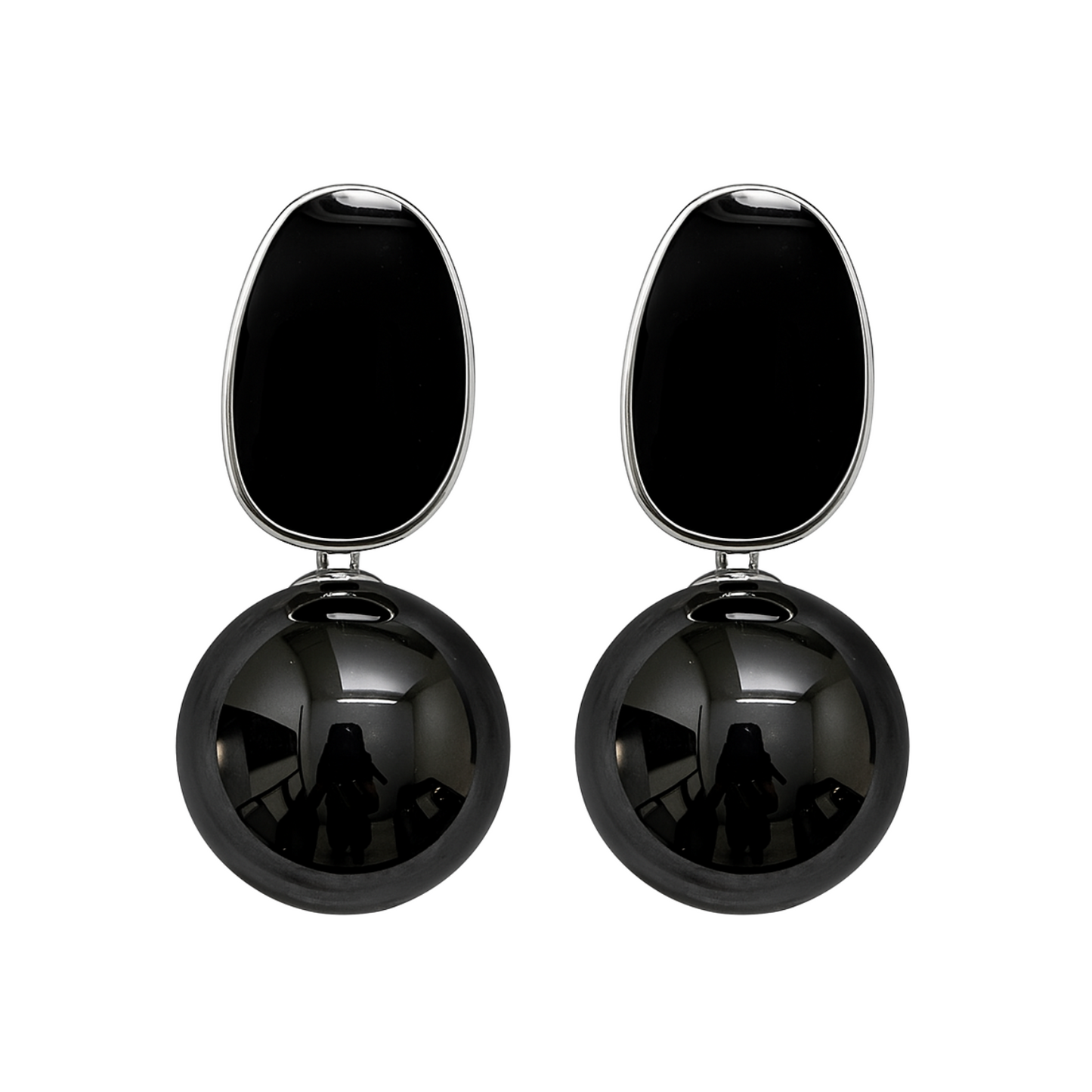 Black spherical earrings with a smaller black oval on top against a white background