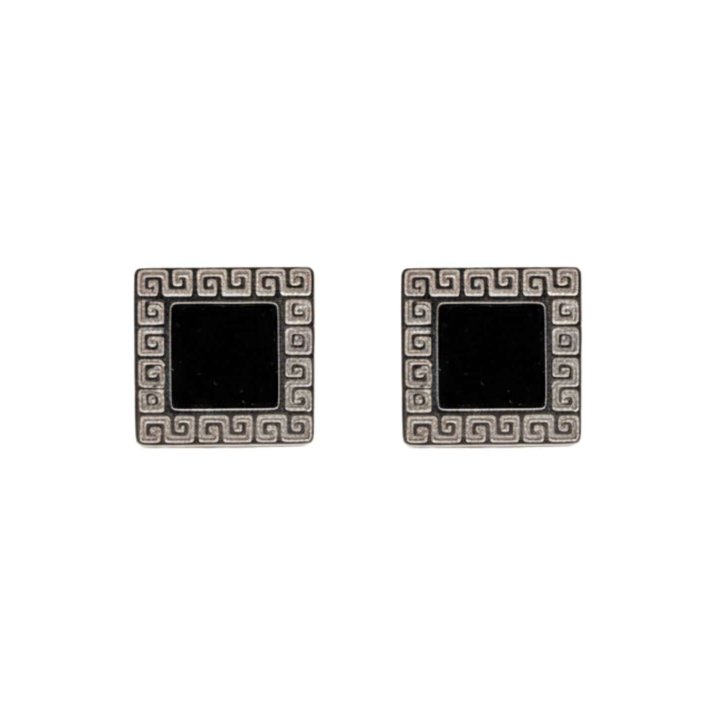 Pair of square earrings with black centers and decorative silver borders on a white background