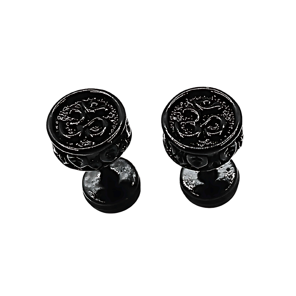 Pair of black om decorative knobs on a white background