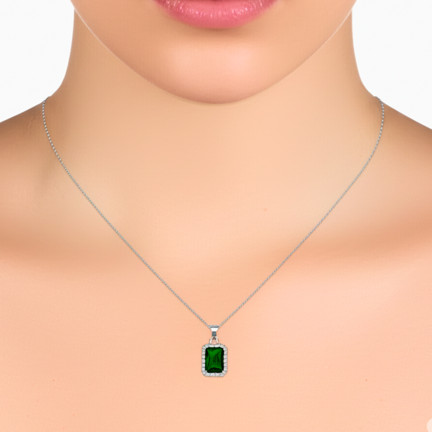 Green gemstone necklace on a mannequin with a white background