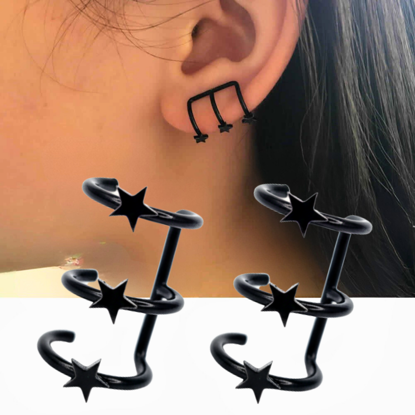 Black star-shaped earrings worn on an ear with a neutral background