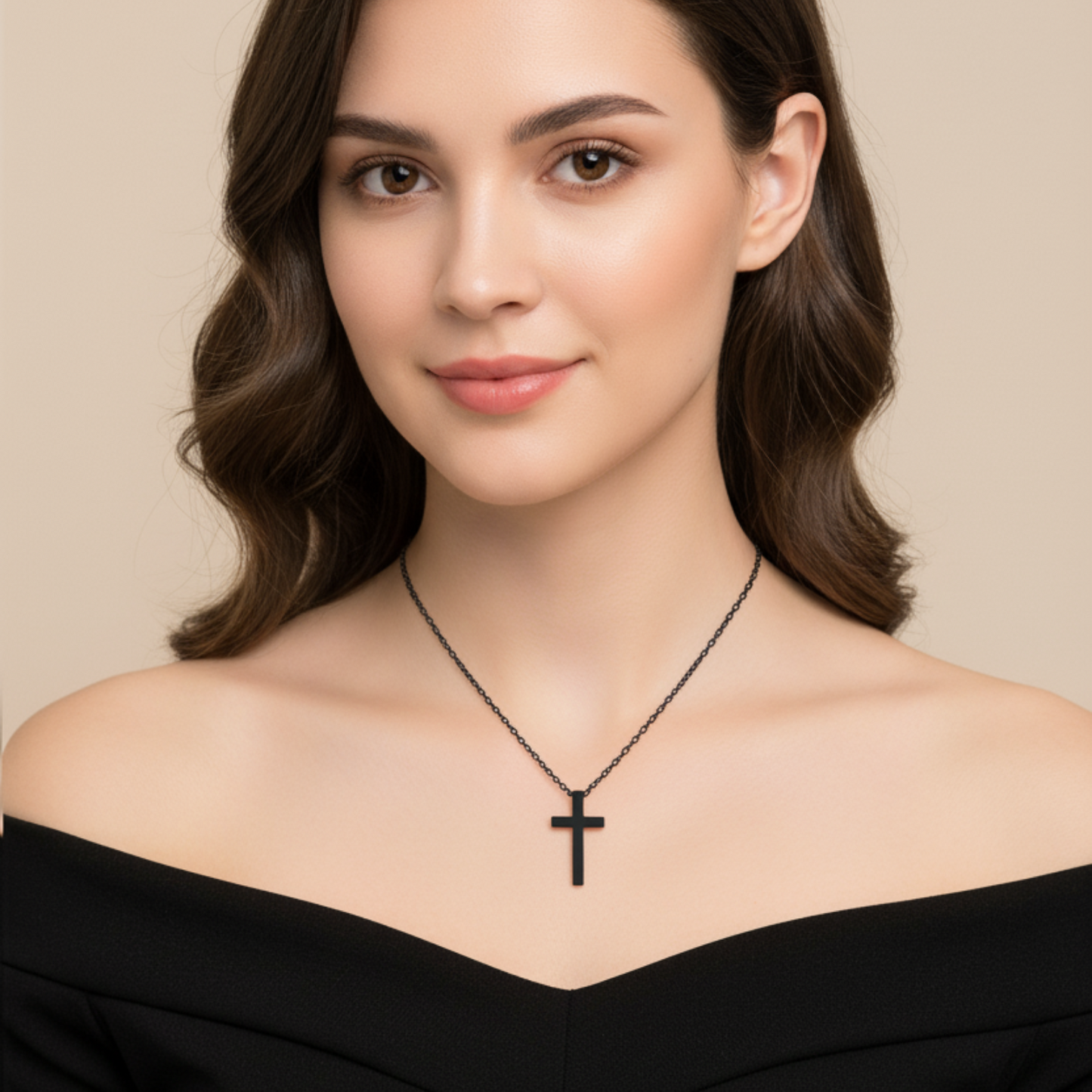 Woman wearing a black cross necklace against a beige background