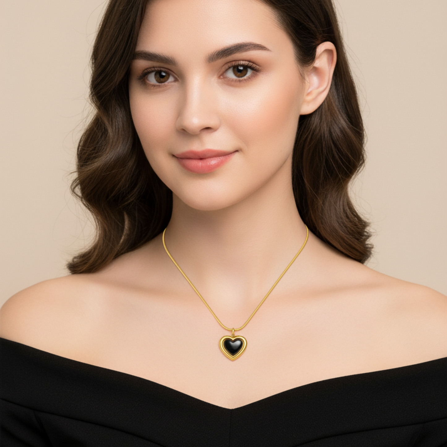 Woman wearing a gold necklace with a heart-shaped pendant on a beige background