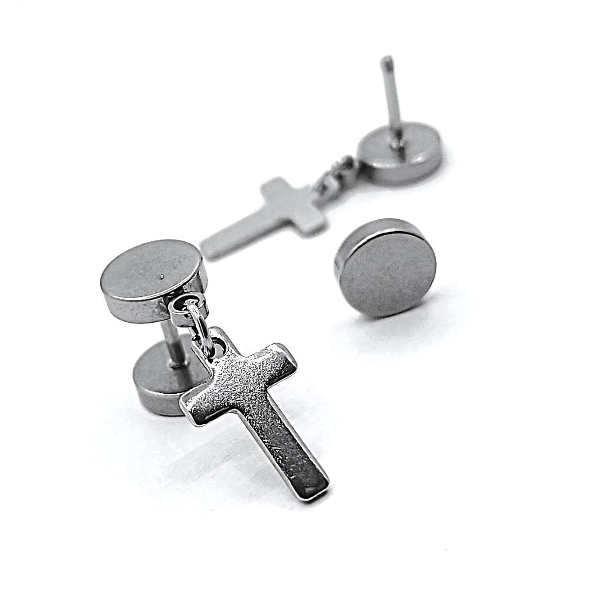 Silver cross earrings on a white background