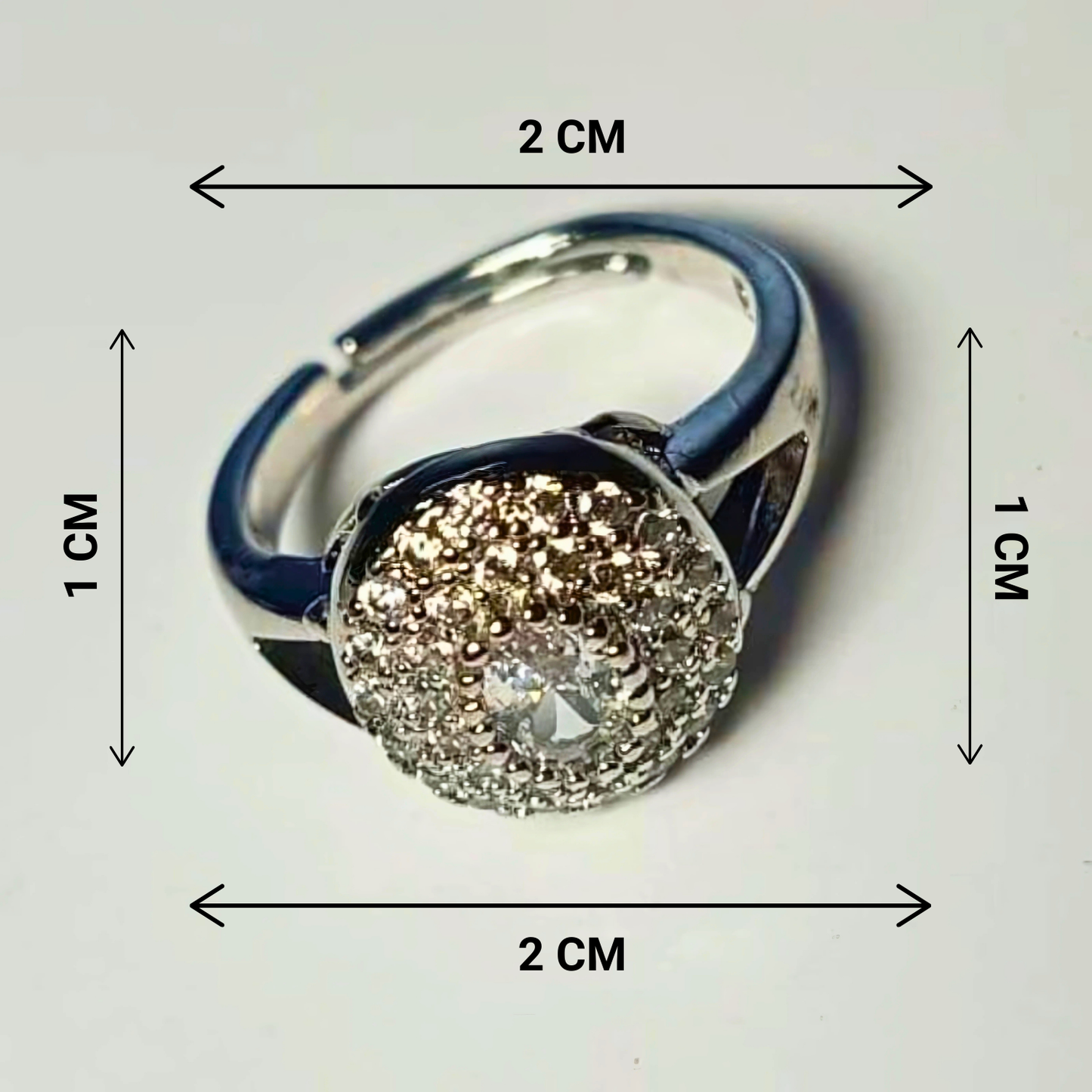 Silver ring with a diamond, shown with dimensions on a white background