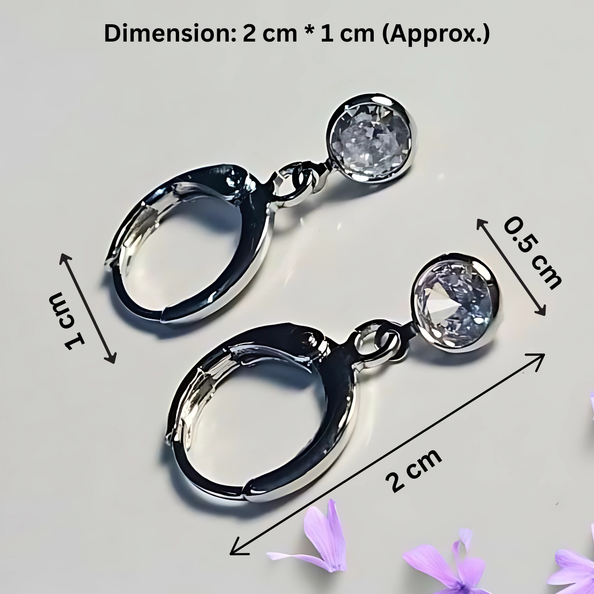 Pair of silver hoop earrings with clear gemstones, shown with measurements on a light gray background.
