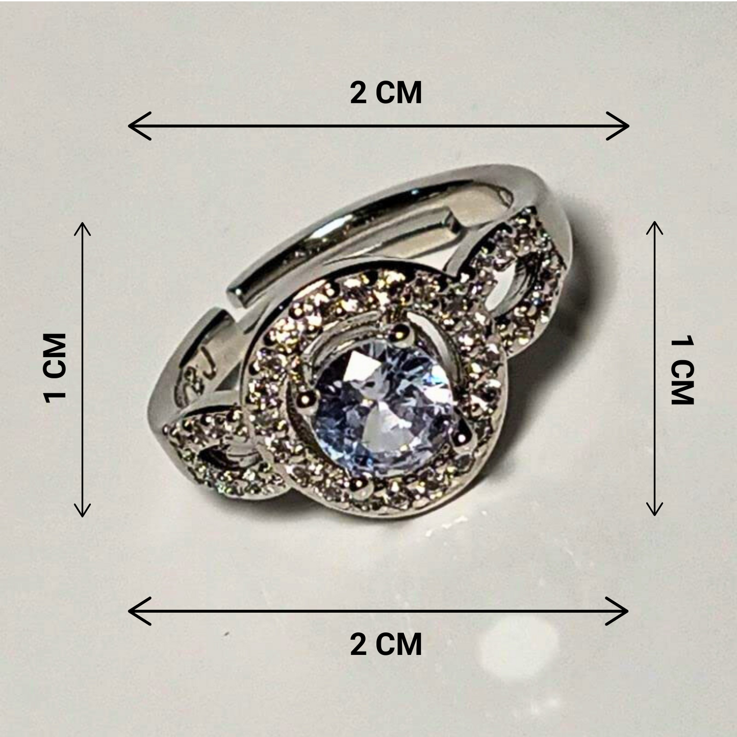 Silver ring with a large central gemstone, shown with dimensions on a light gray background.