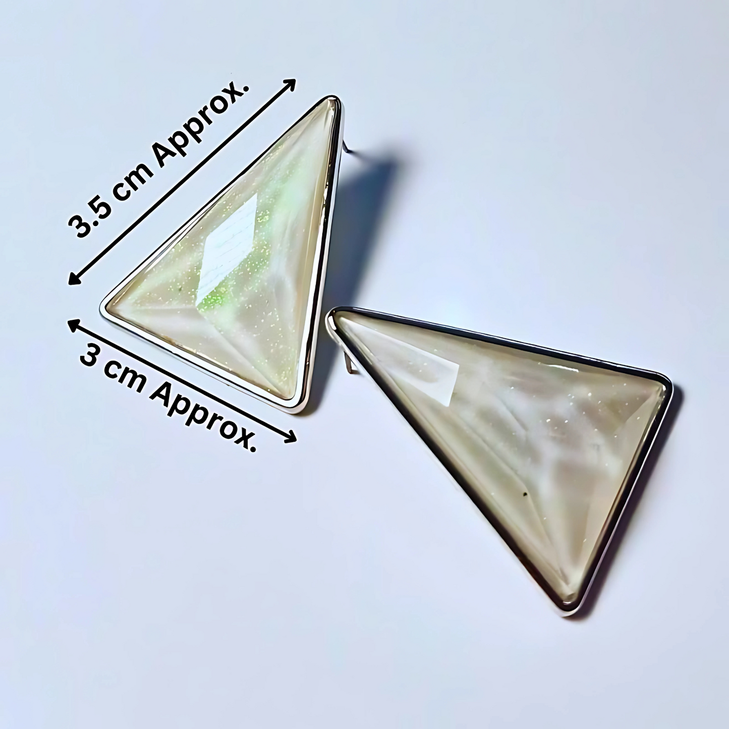 Triangular earrings with measurements on a light blue background