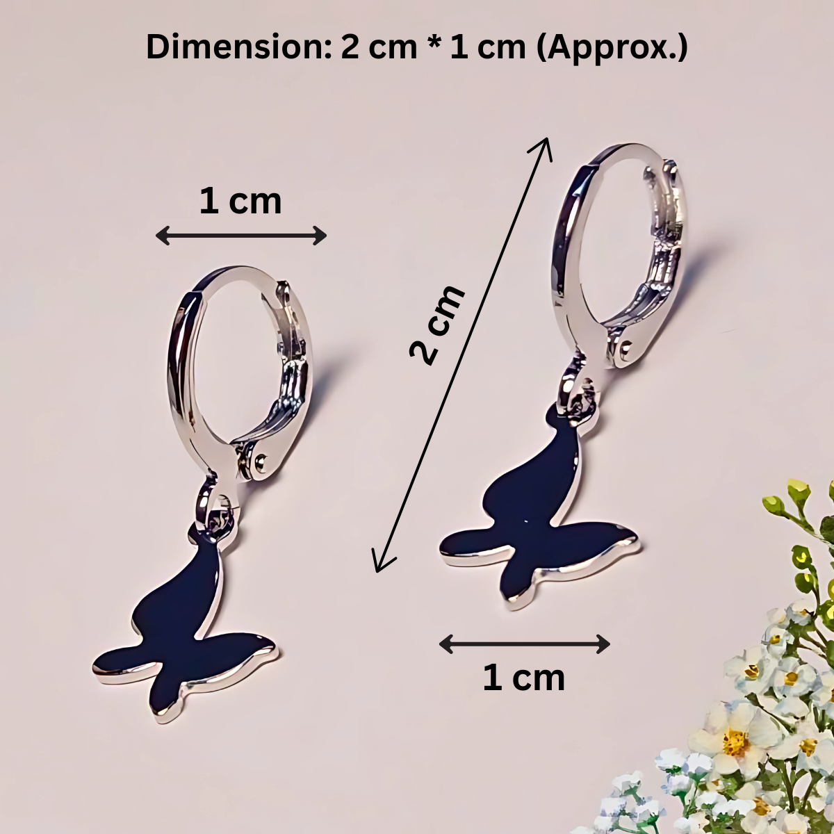 Butterfly-shaped earrings with dimensions indicated on a light background