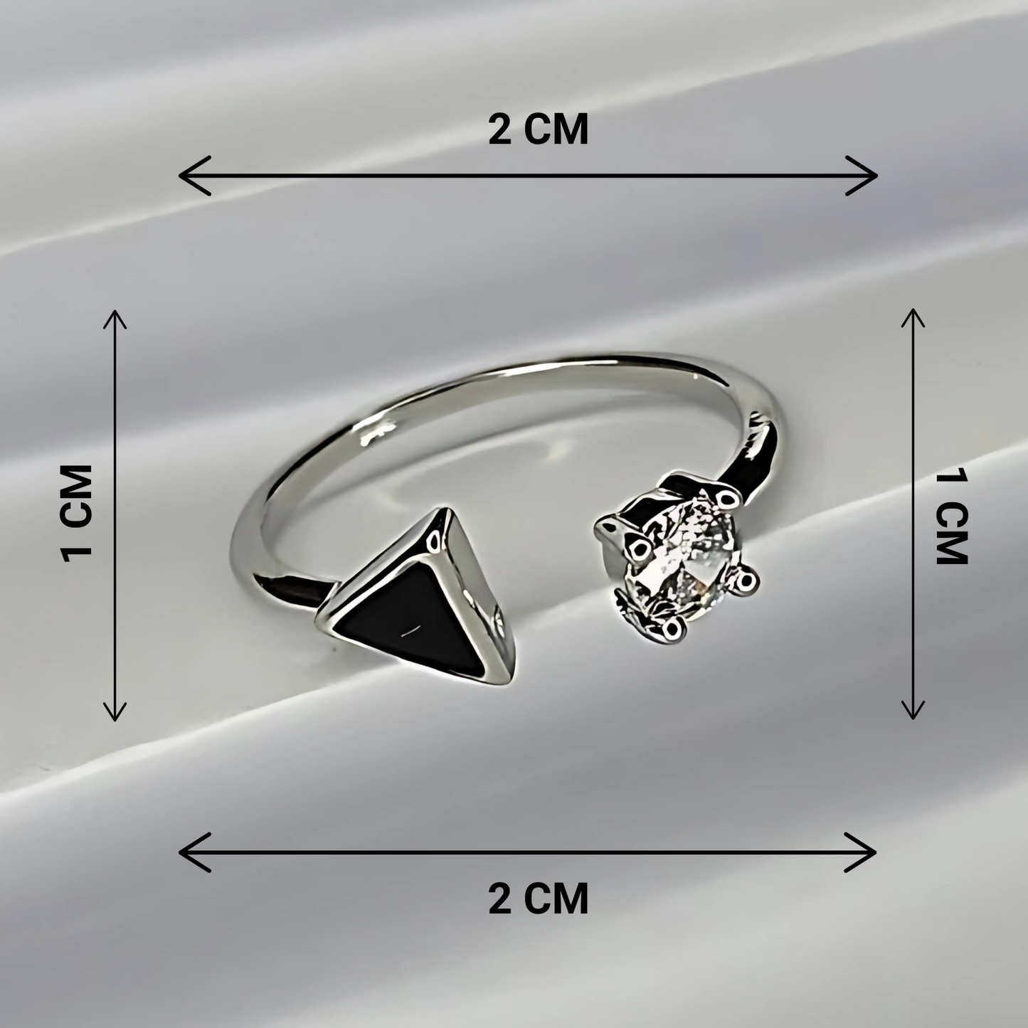 Silver ring with geometric design and diamond, shown with measurements on a white background