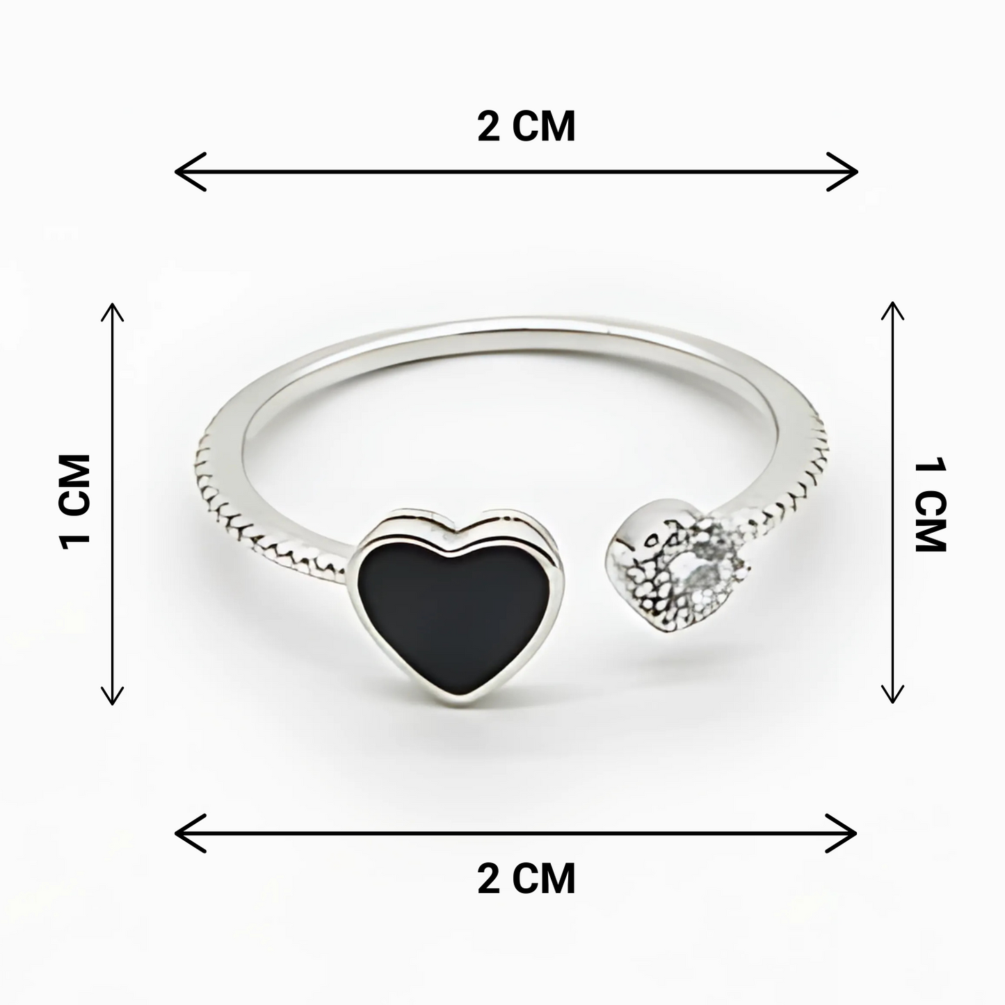 Silver ring with heart-shaped black and clear gemstones, shown with measurements on a white background.
