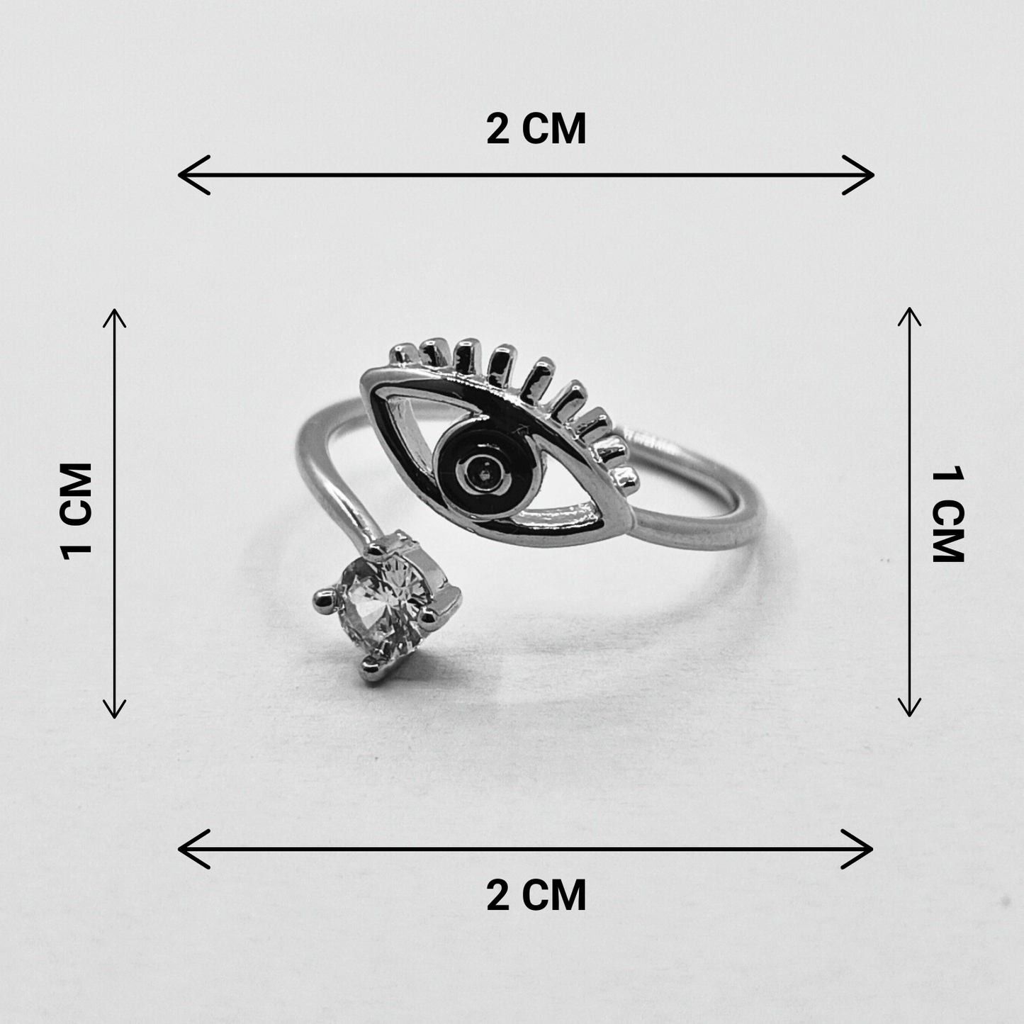 Black eye and diamond ring with measurement in grey background