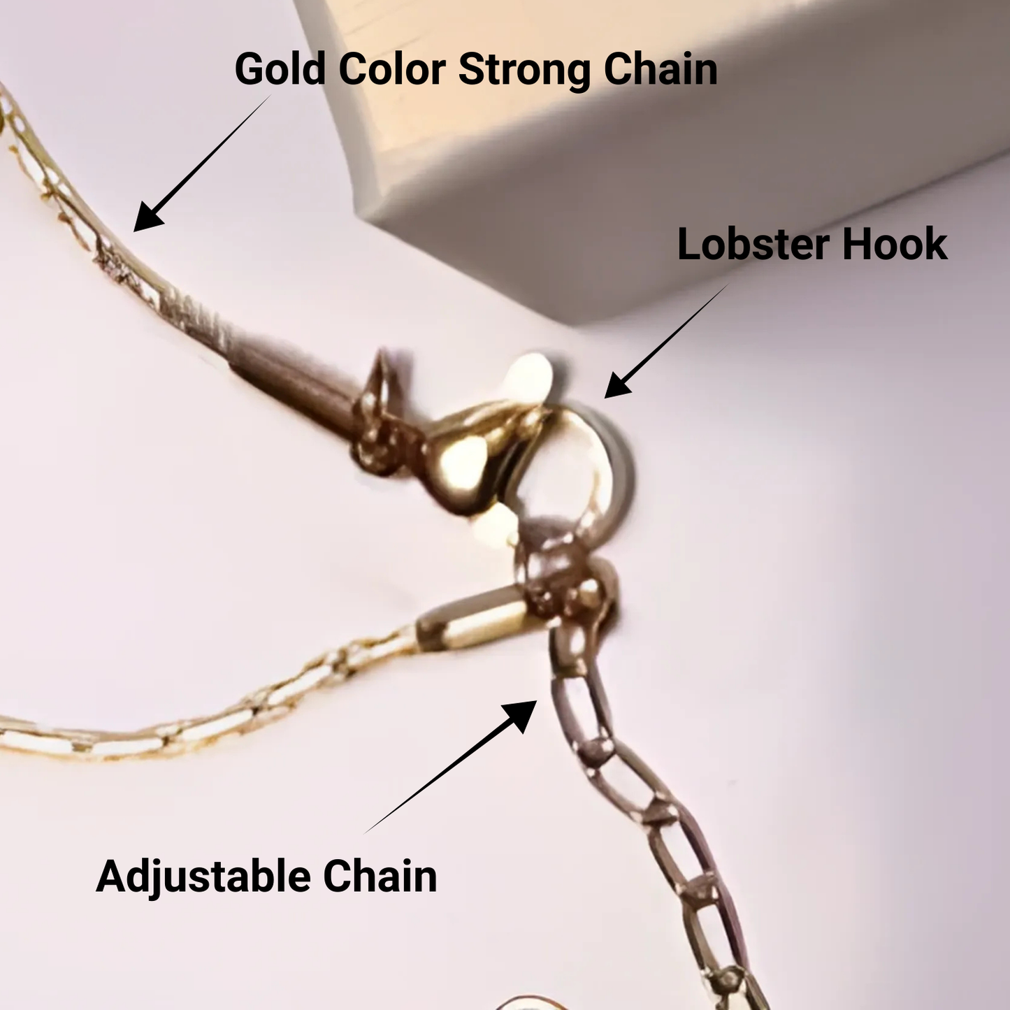 Gold color strong chain with lobster hook and adjustable chain on a white background