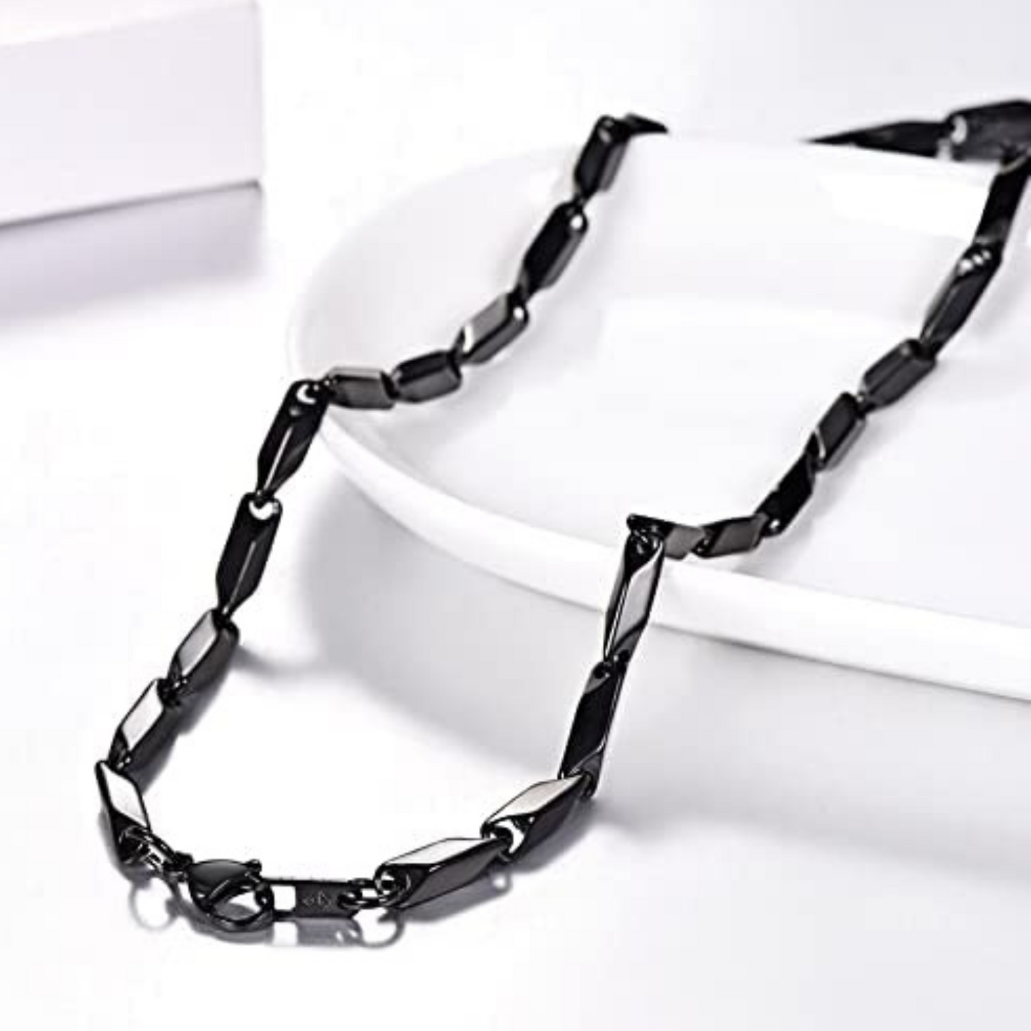 Black chain necklace on a white background