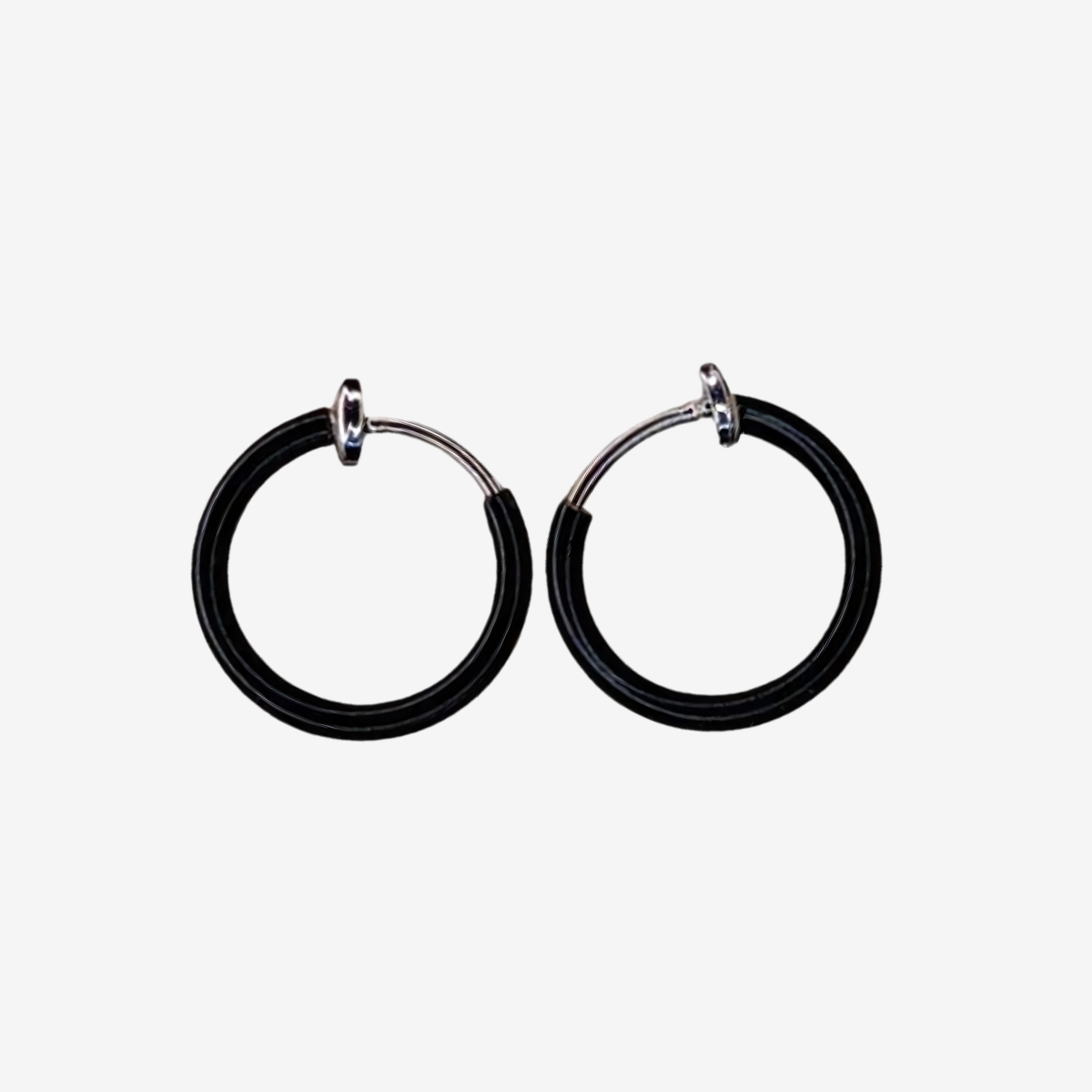 Black hoop earrings on a white background