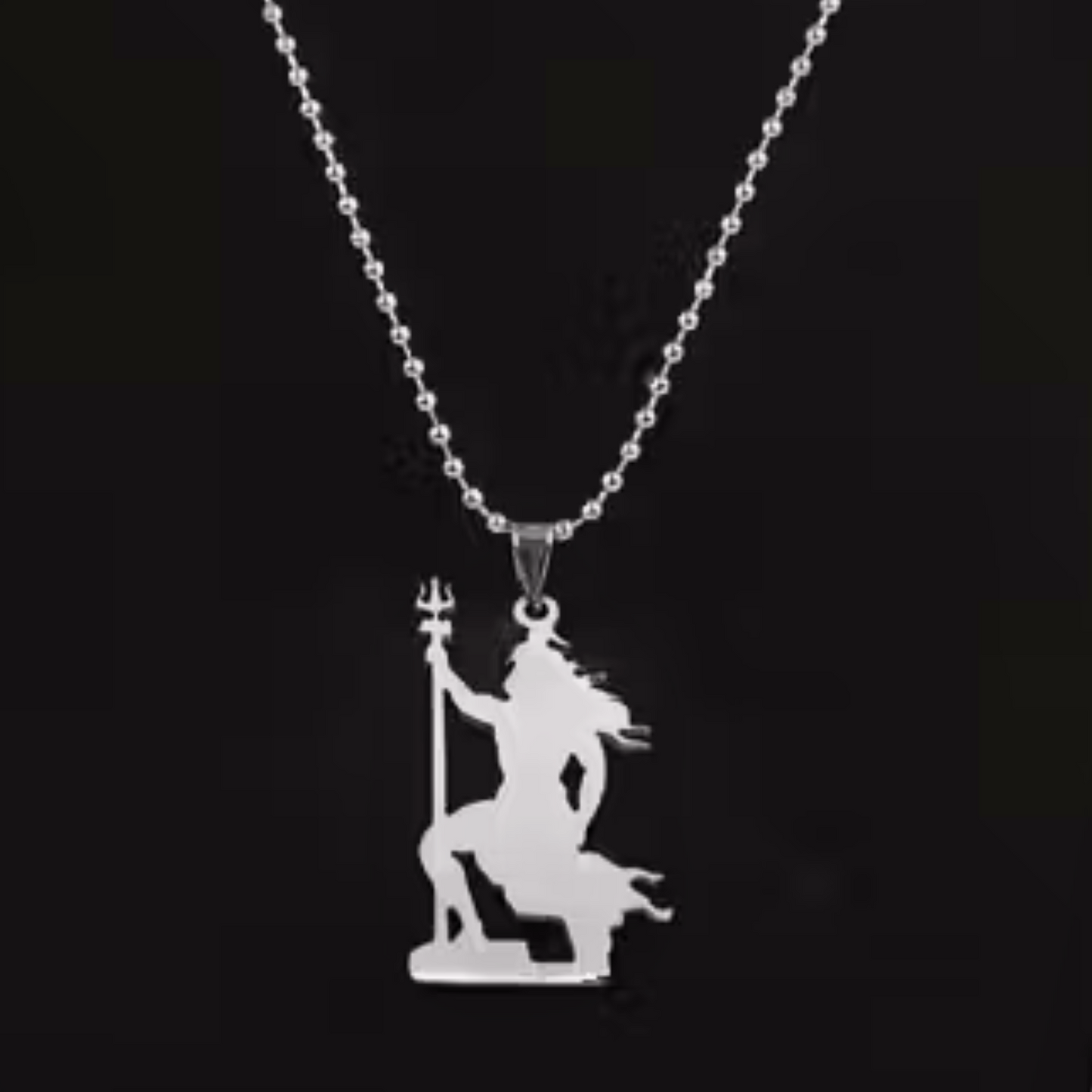 Silver pendant necklace with a shiva design on a black background