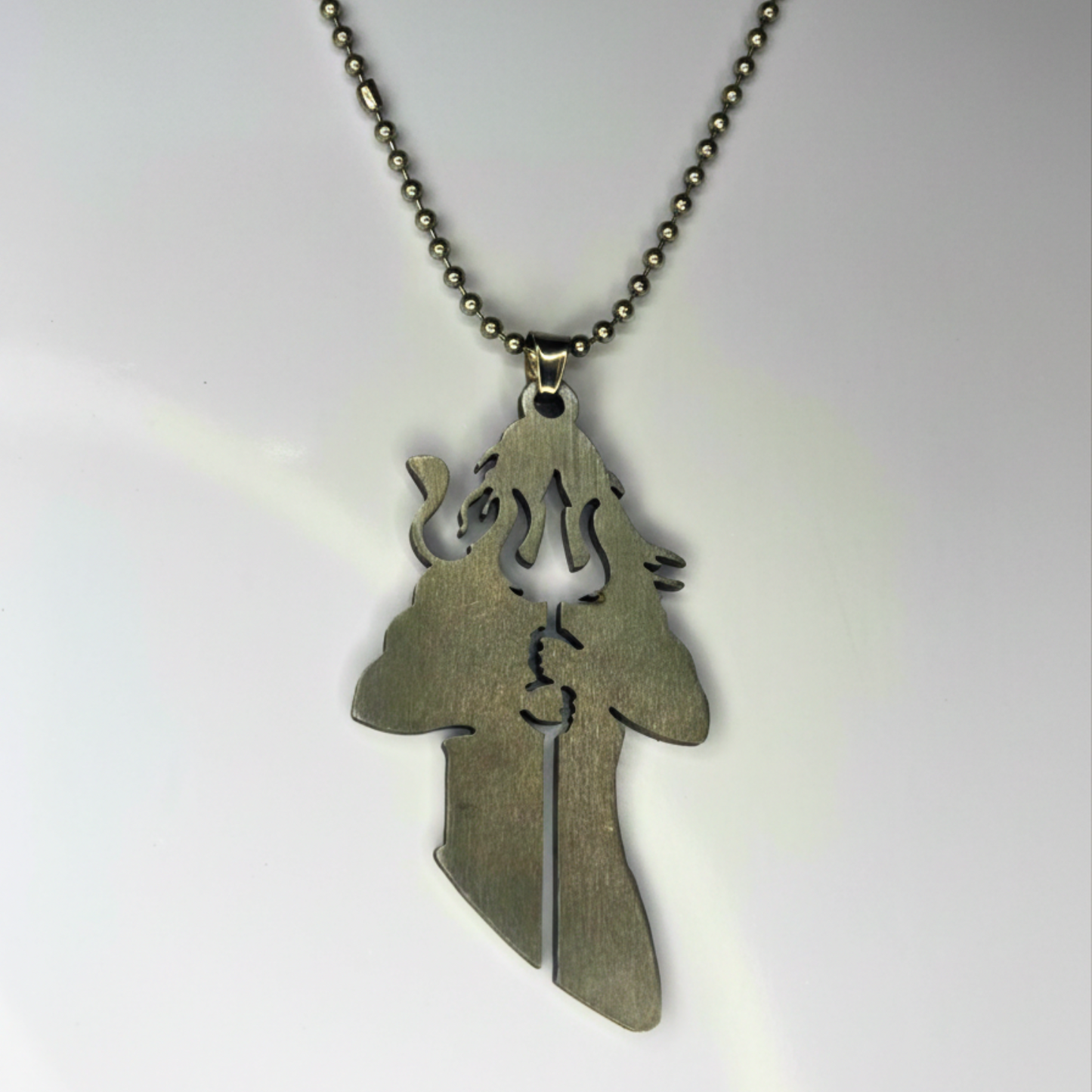 Silver shiva pendant necklace on a white background
