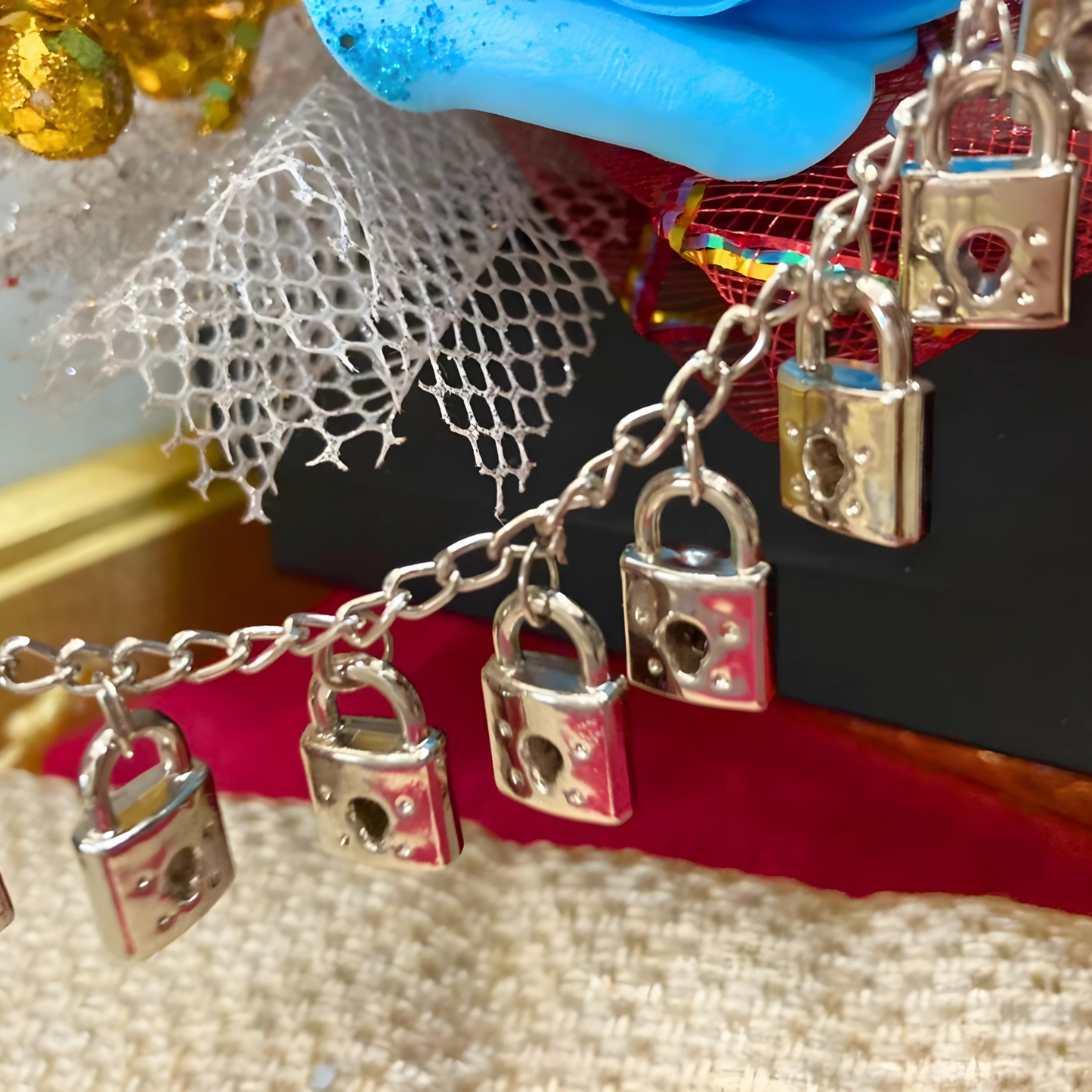 Bracelet with padlock charms on a textured surface
