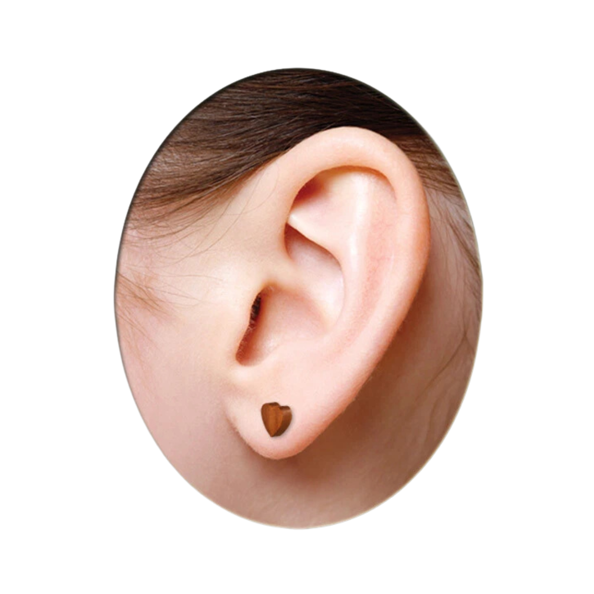 Heart-shaped earring worn on a person's ear against a white background