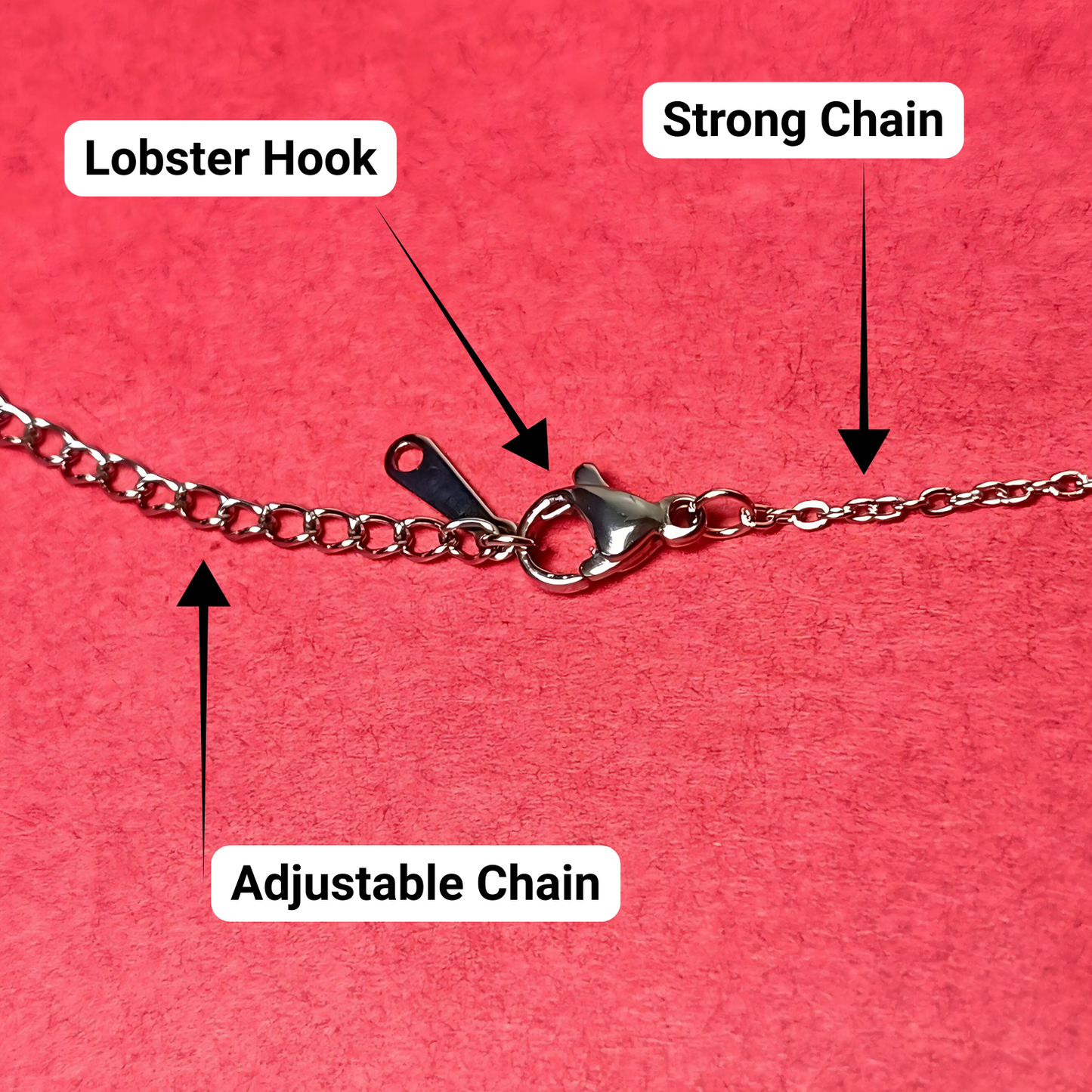 Chain necklace with labeled lobster hook, strong chain, and adjustable chain on a red background