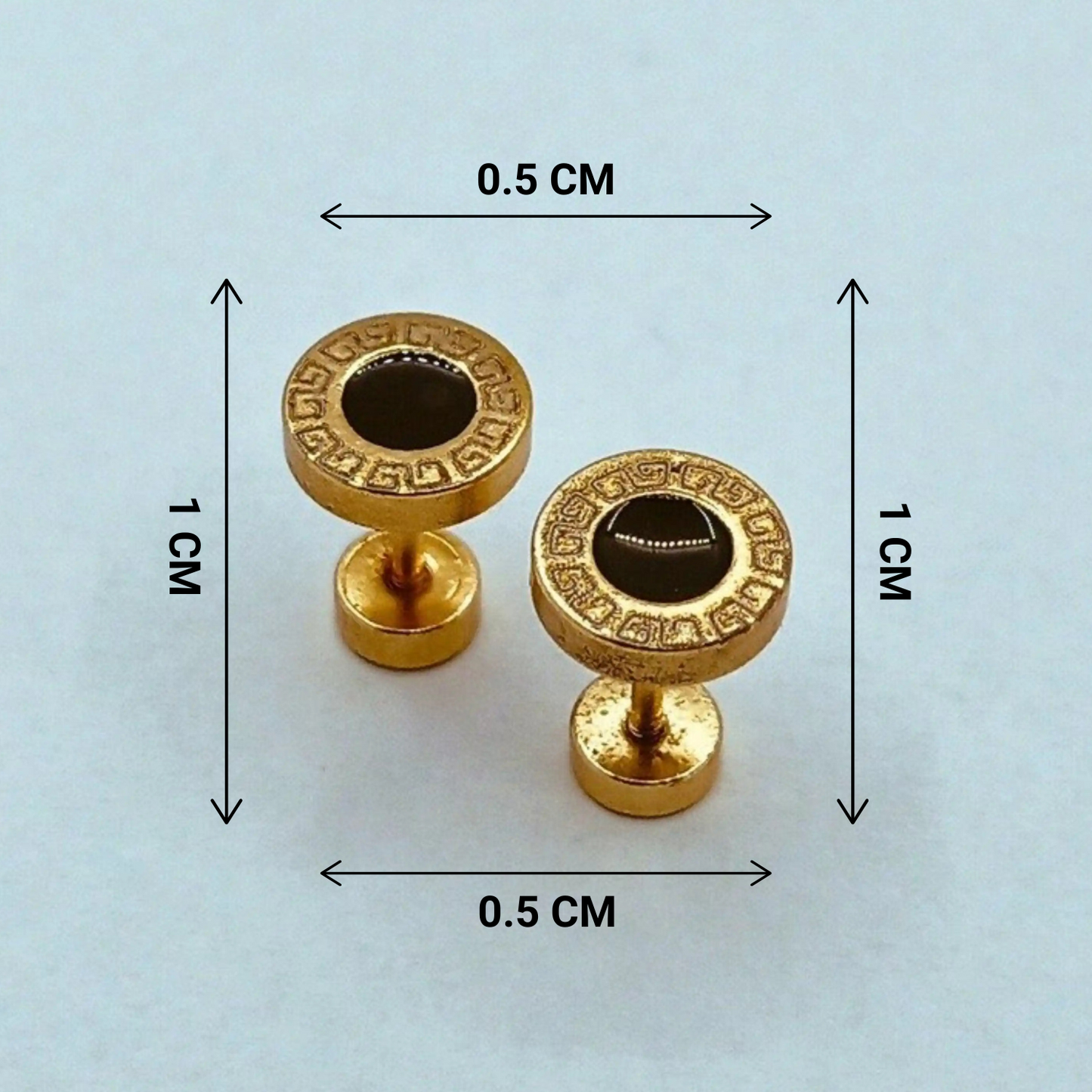Gold earrings with decorative patterns and measurements on a light blue background