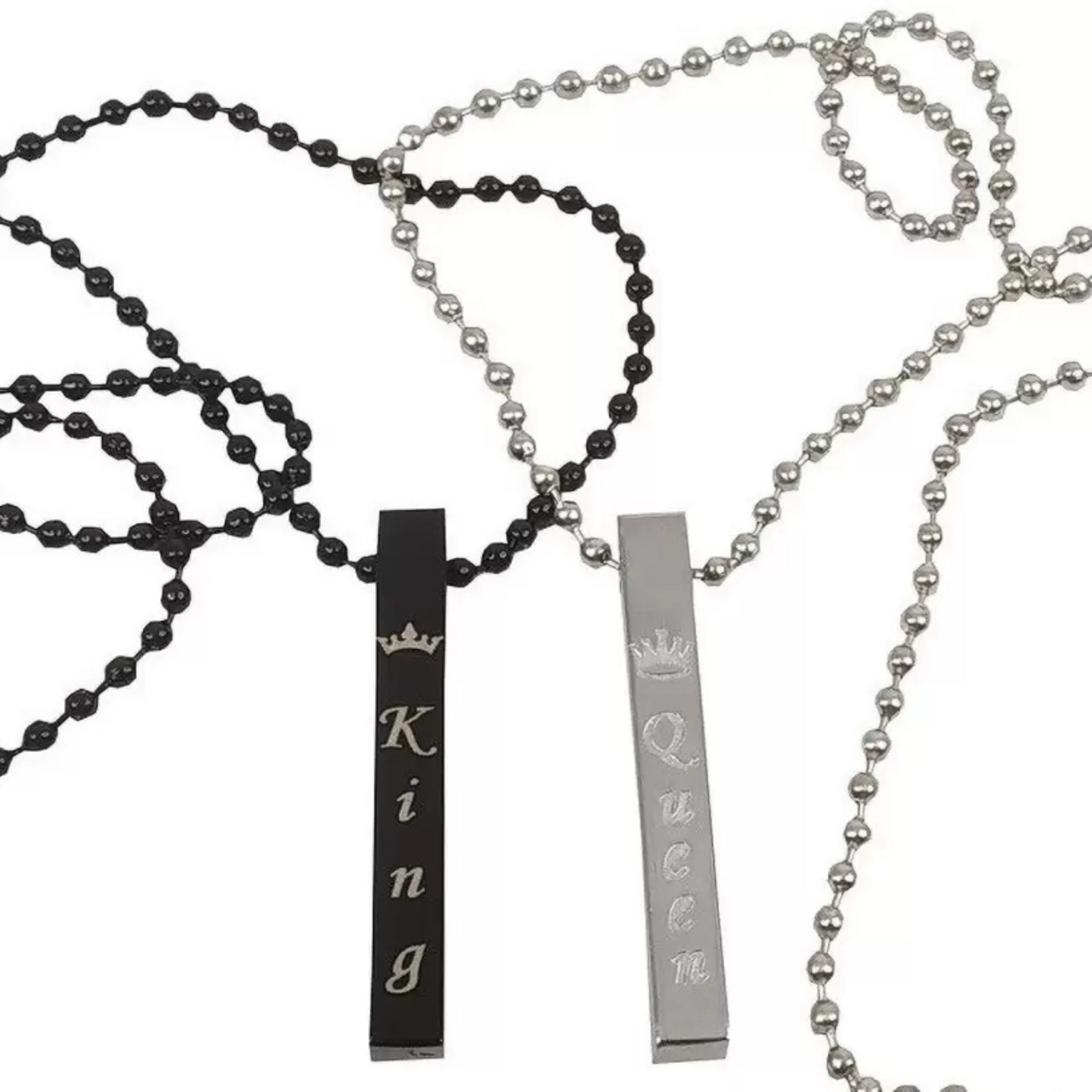 Two necklaces with 'King' and 'Queen' pendants on a white background
