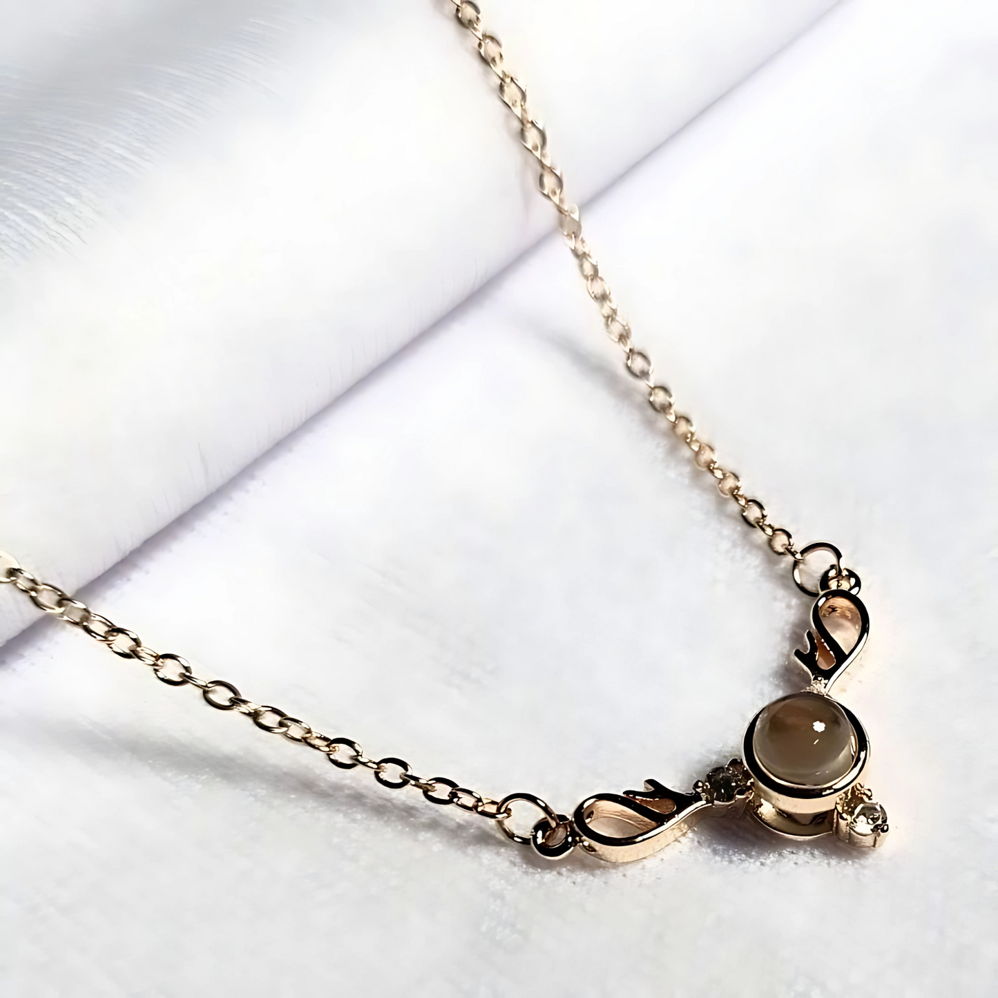 Gold bracelet with a clasp on a white background