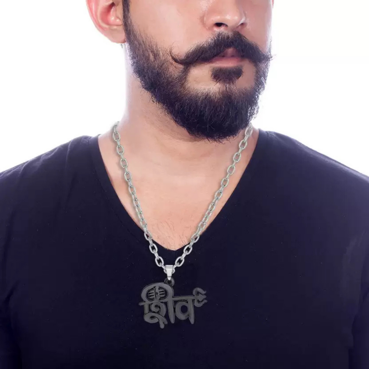 Man wearing a black shirt with a silver chain necklace on a white background