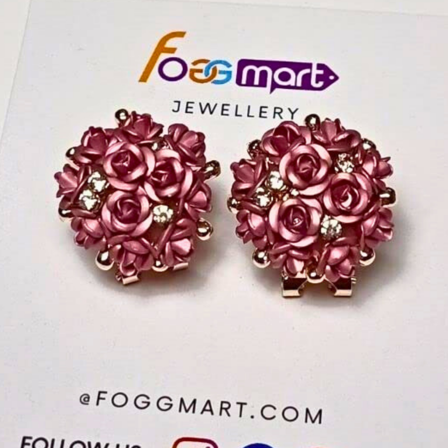 Pink rose-shaped earrings on a Foggmart Jewellery card.