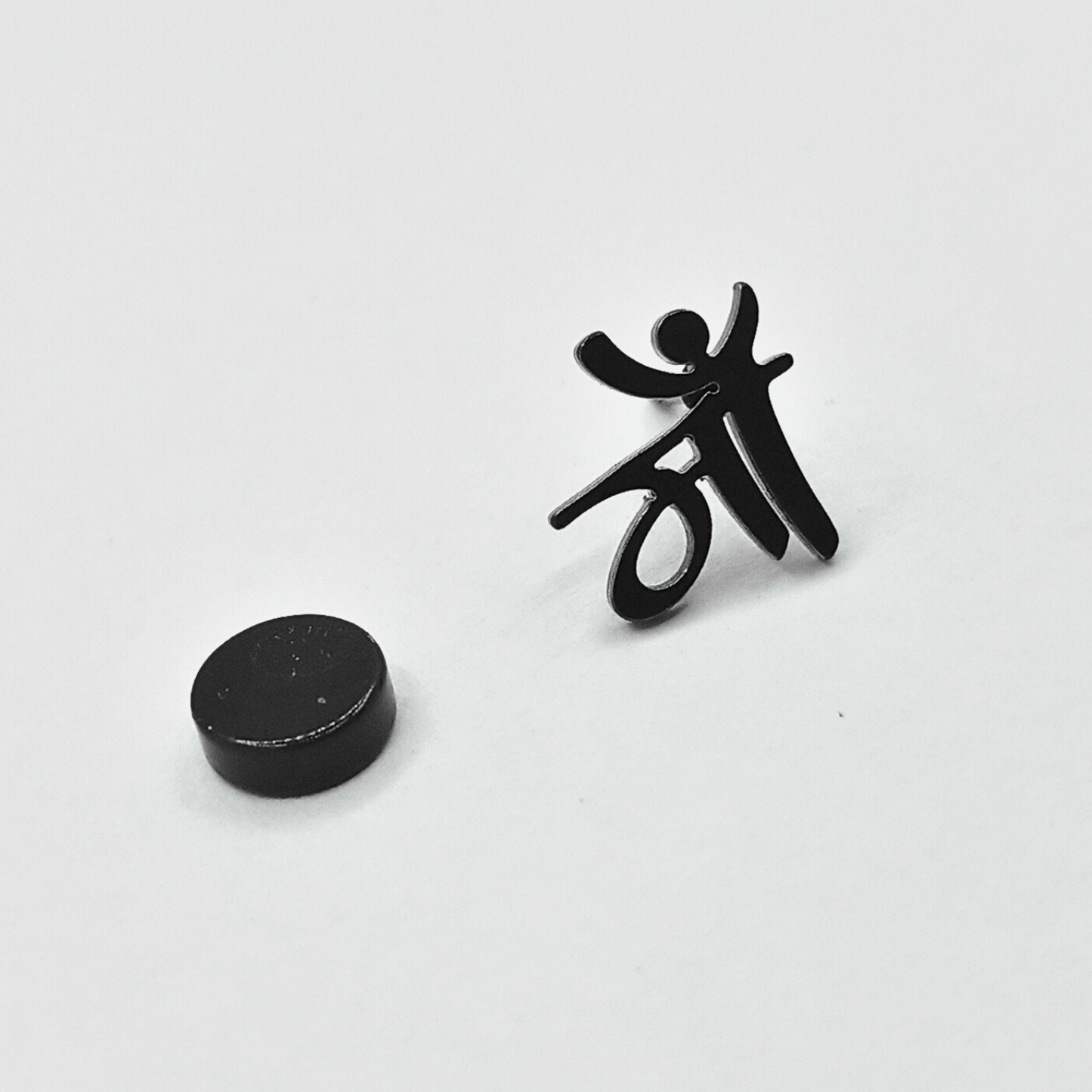 Black abstract sculpture on a white background