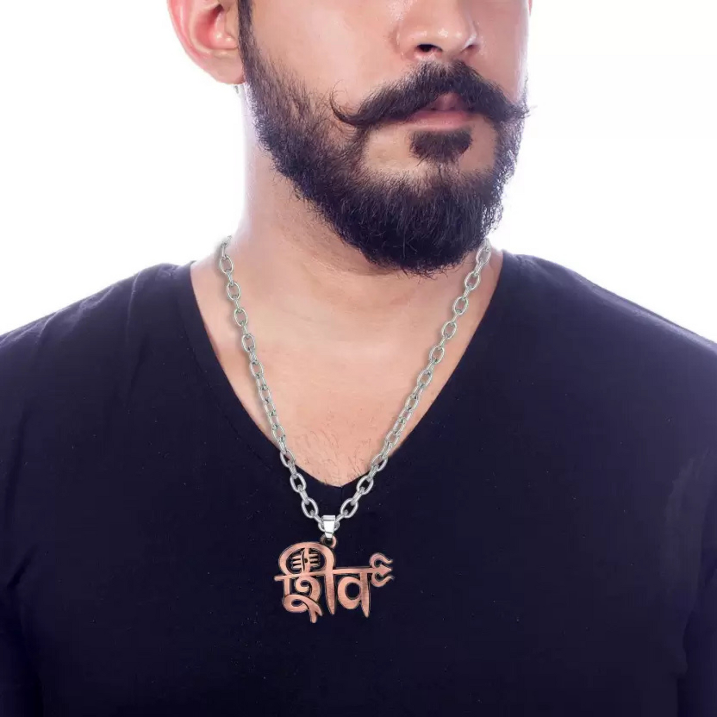 Man wearing a black shirt with a silver chain necklace featuring a 'Shiva' pendant.