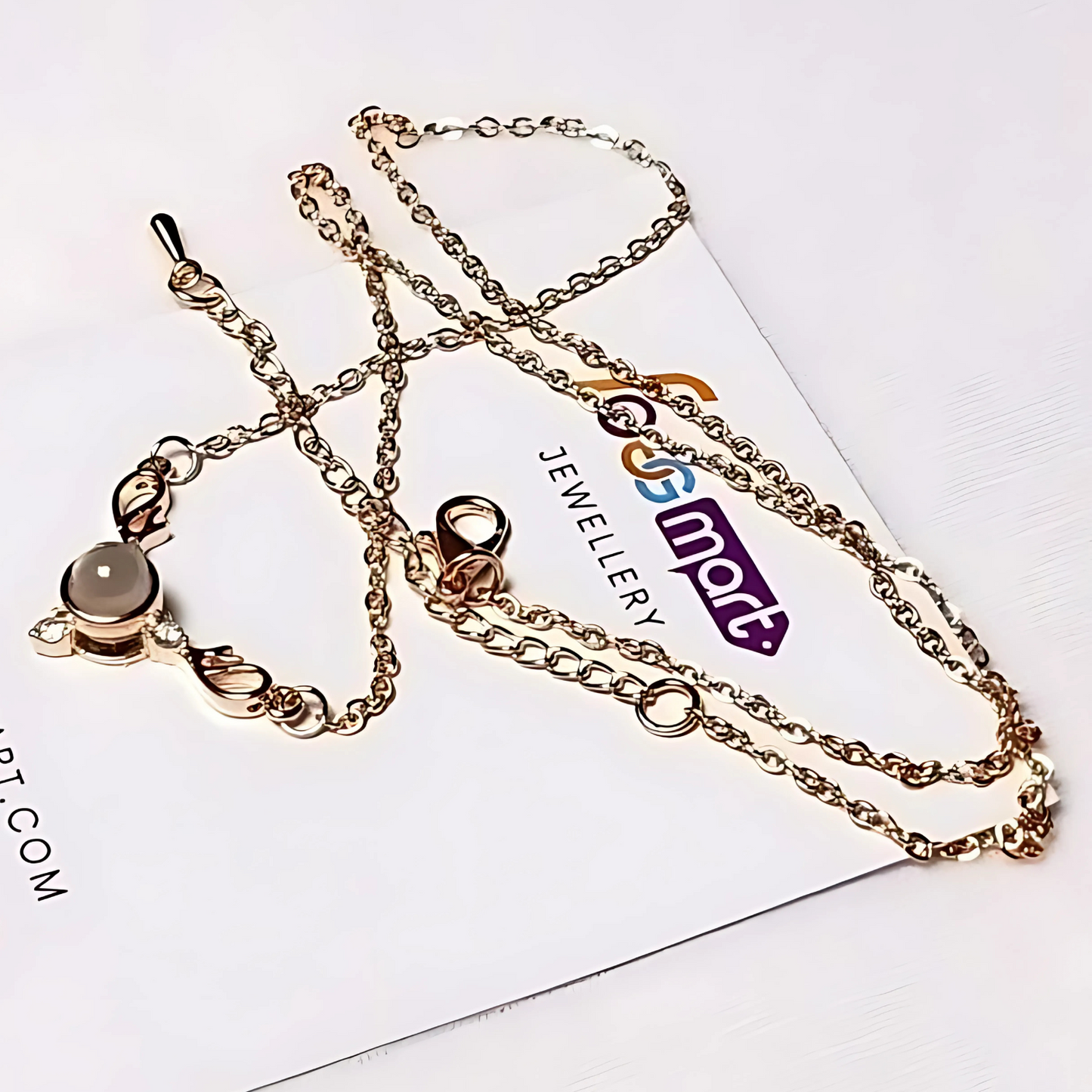 Gold chain necklace on a white card with 'Jewellery Foggmart' branding.