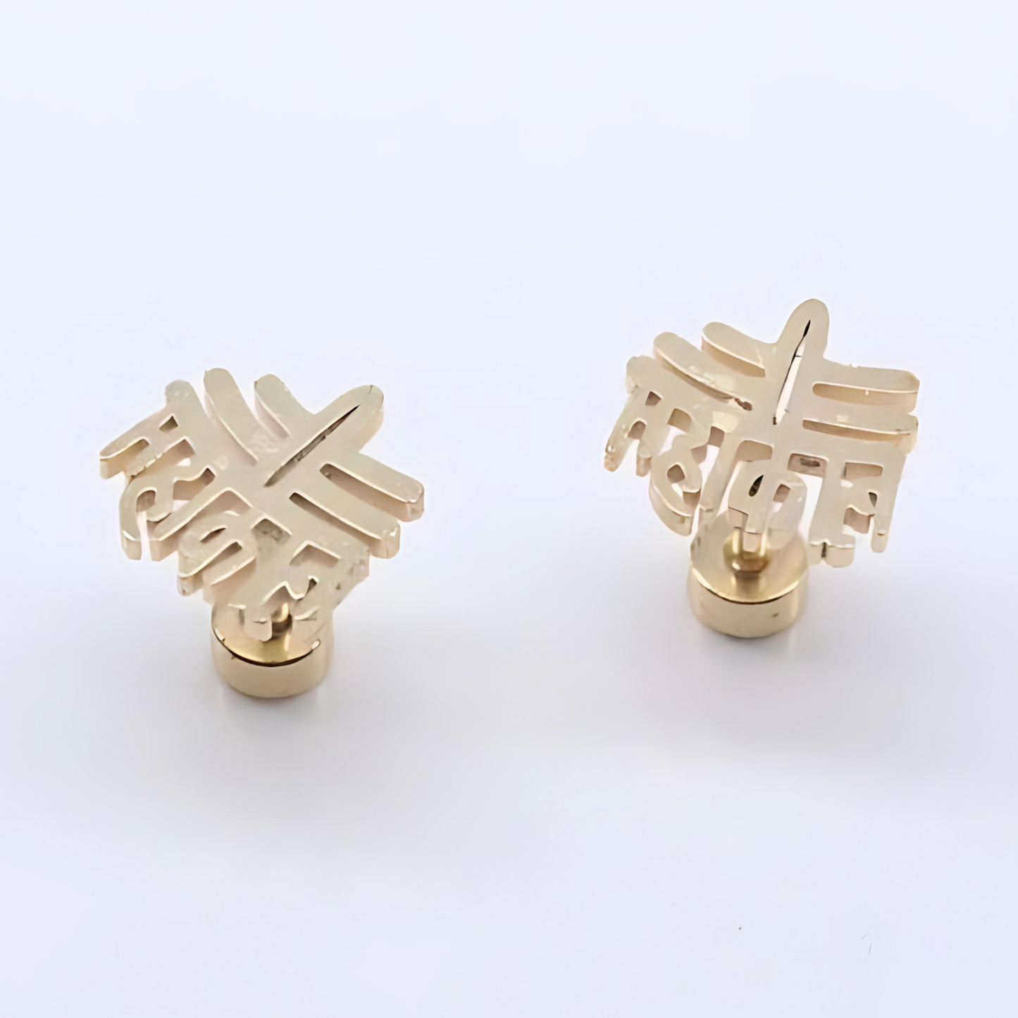 Gold earrings with a unique design on a white background