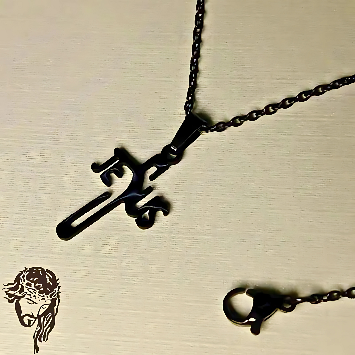 Black metal necklace with a unique pendant on a beige background