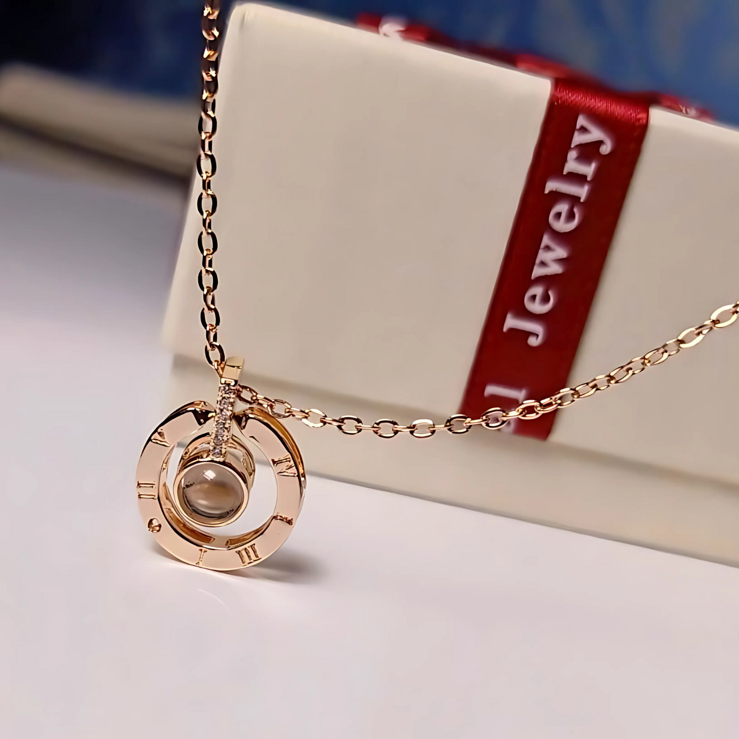 Gold necklace with a pendant on a jewelry box background