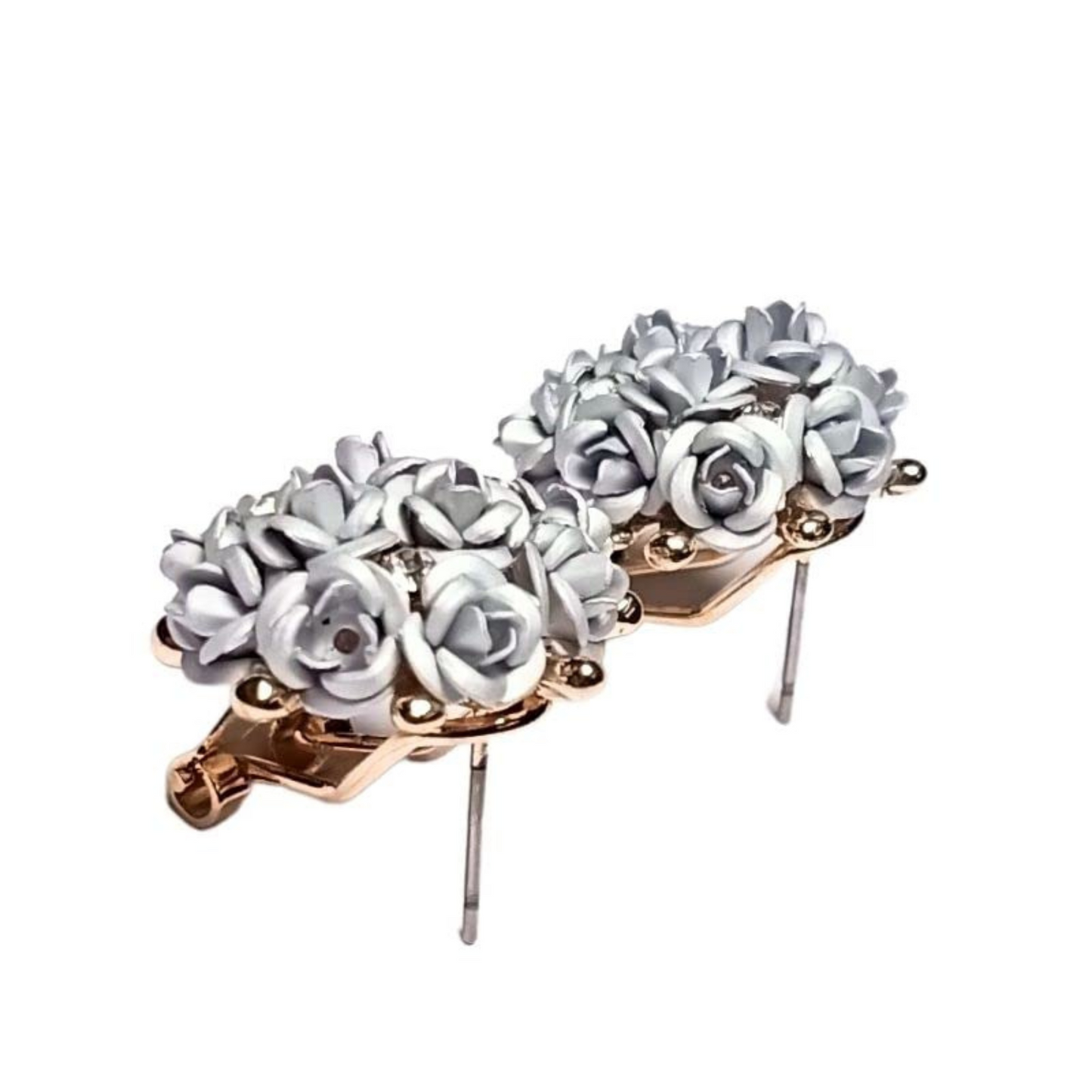 Floral hair clip with white flowers and gold accents on a white background