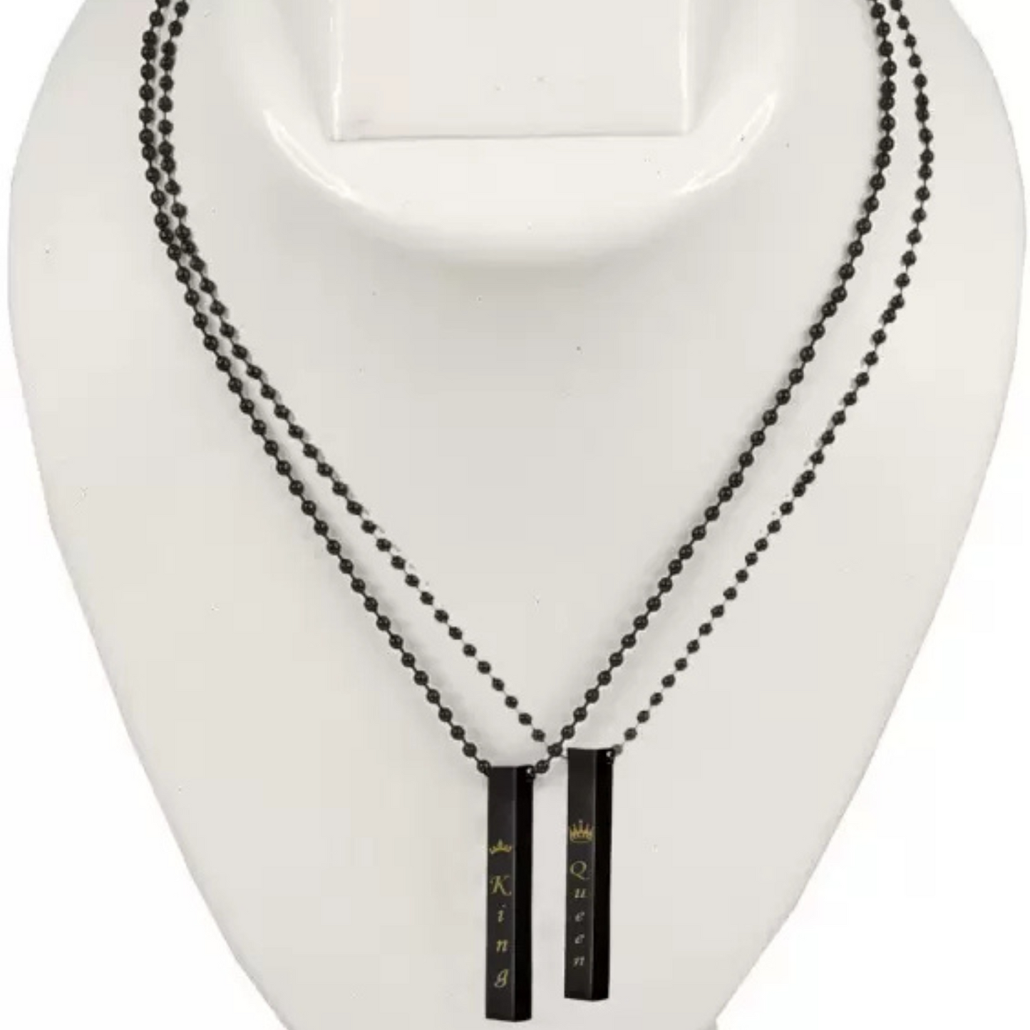 Black beaded necklace with pendant on a white mannequin bust