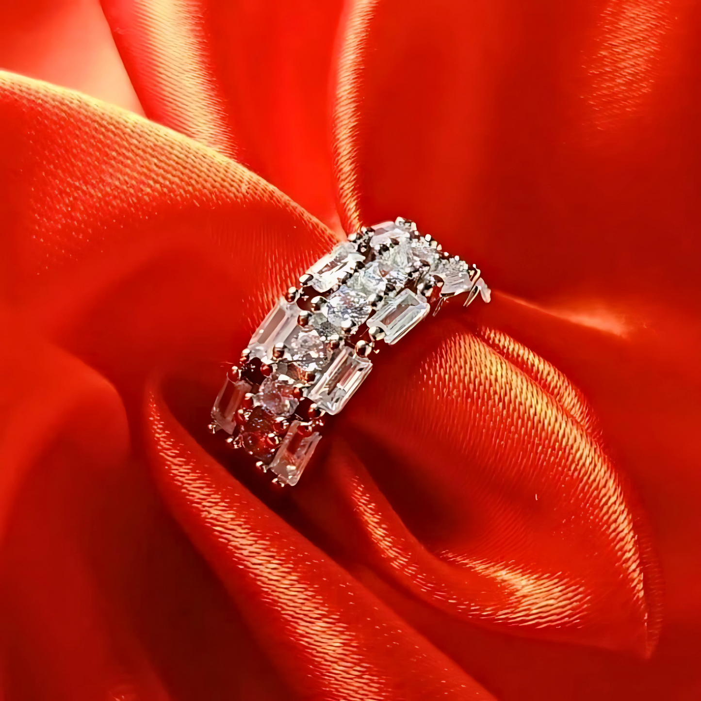 Diamond ring on a red fabric background