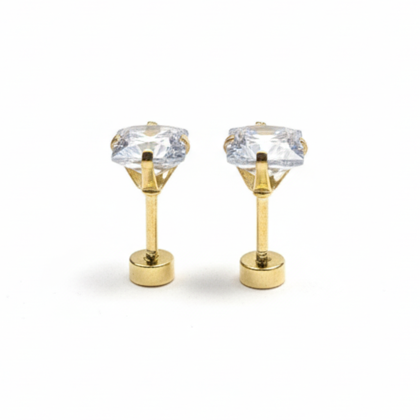 Gold earrings with clear gemstones on a white background