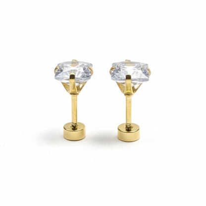 Gold earrings with clear gemstones on a white background