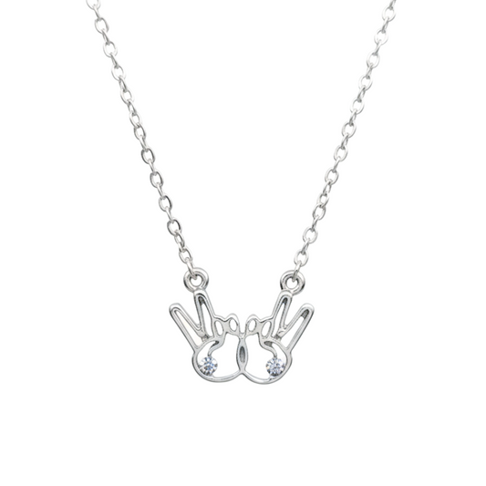 Silver necklace with a unique pendant on a white background