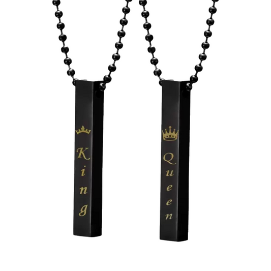 Two black necklaces with 'King' and 'Queen' text on a white background