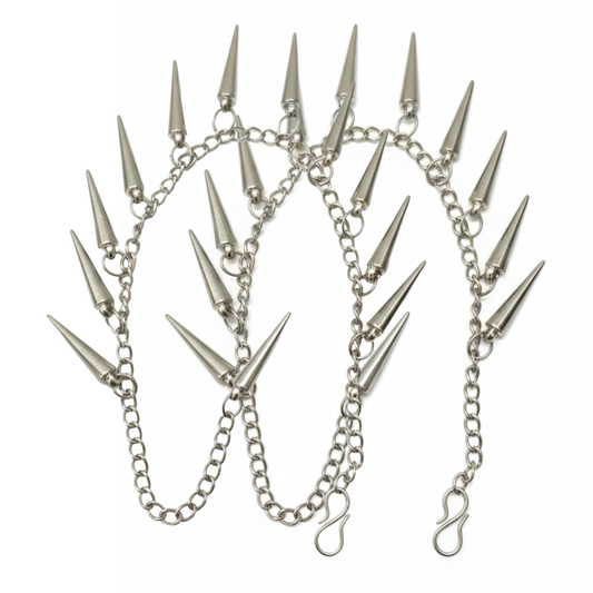 Silver chain with spike attachments on a white background