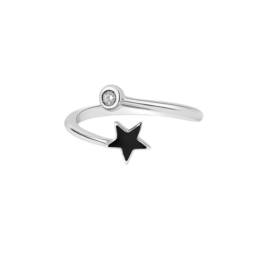 Silver ring with a black star and small diamond on a white background