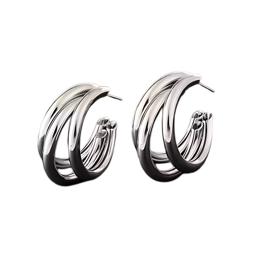Pair of silver hoop earrings on a white background