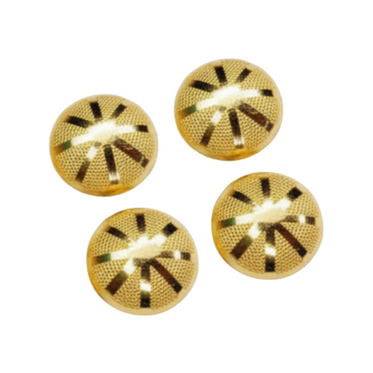 Four gold buttons stud with a textured pattern on a white background