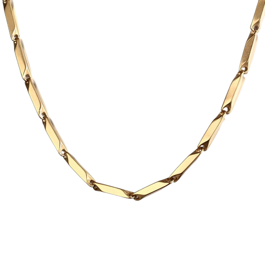 Gold chain necklace on a white background