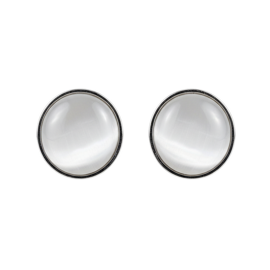 Pair of round earrings with a metallic finish on a white background